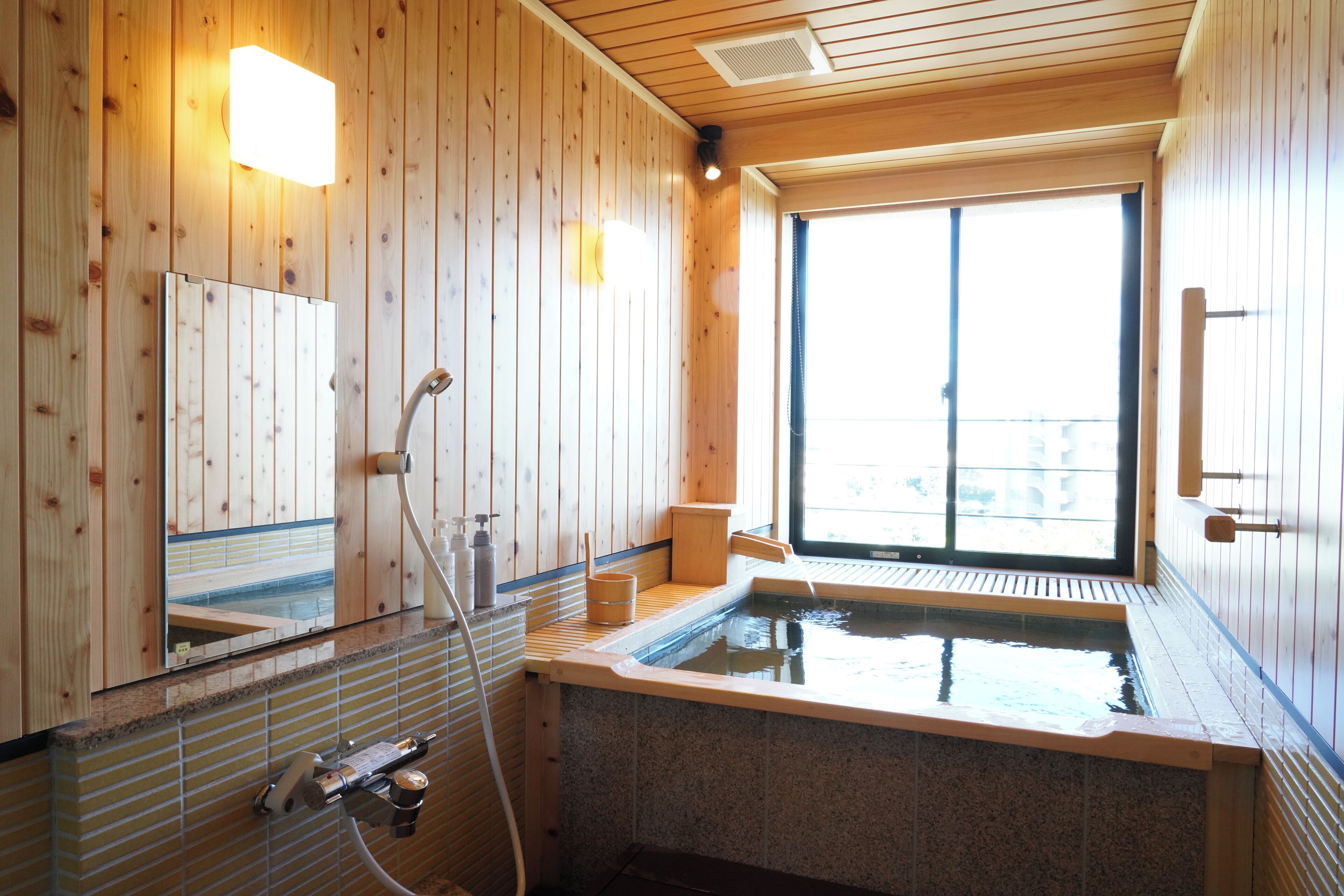 Family Room, Multiple Beds | Bathroom | Hair dryer, slippers, electronic bidet, towels