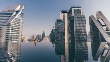 Outdoor pool, open 6:00 AM to 10:00 PM, free cabanas, pool umbrellas