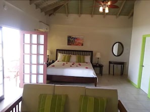 Deluxe Suite, Pool View | In-room safe, desk, iron/ironing board, rollaway beds