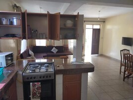 Full-sized fridge, microwave, dining tables