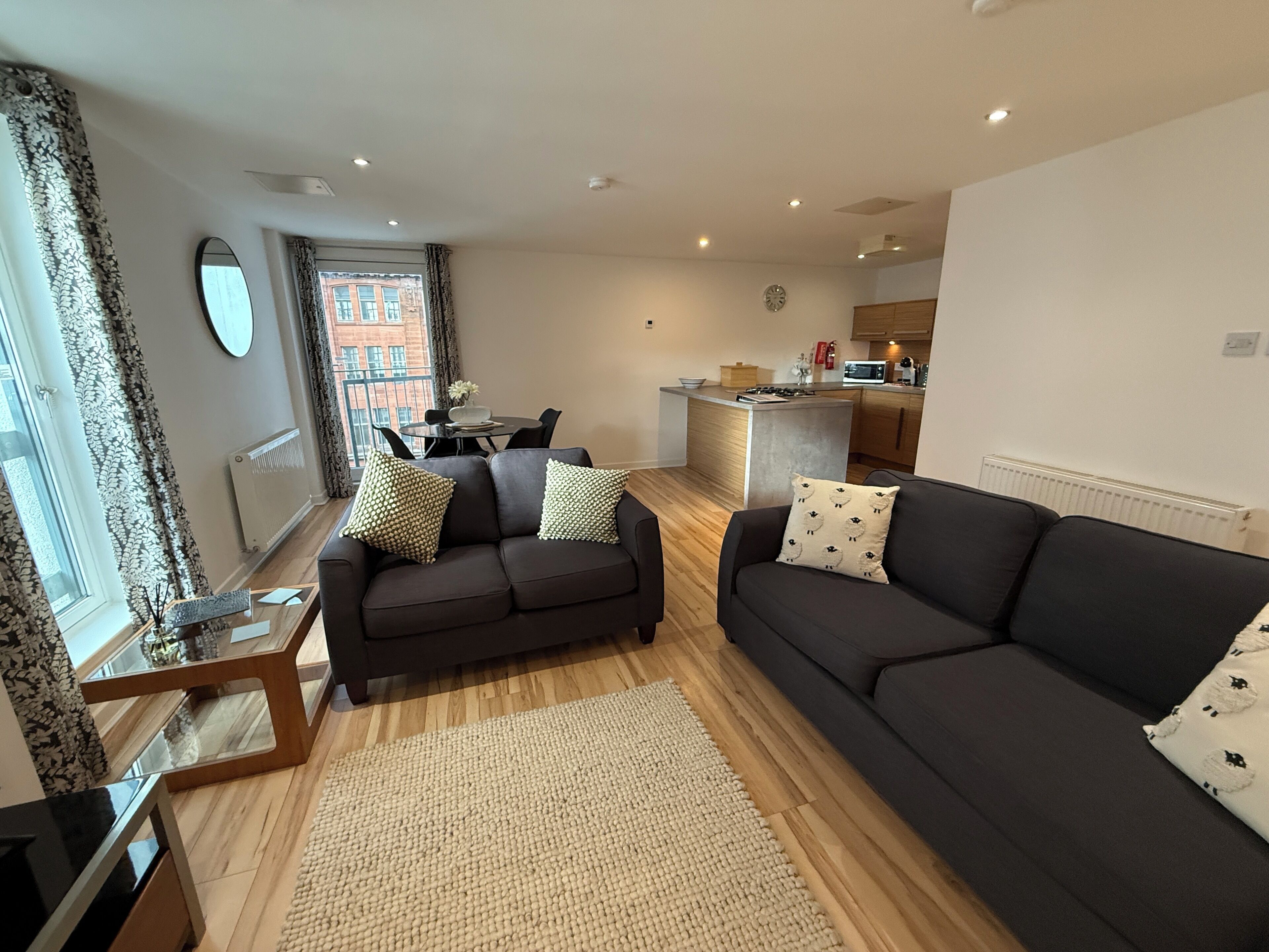 Apartment, 1 Bedroom, Balcony, City View | Living area | 50-inch Smart TV with digital channels
