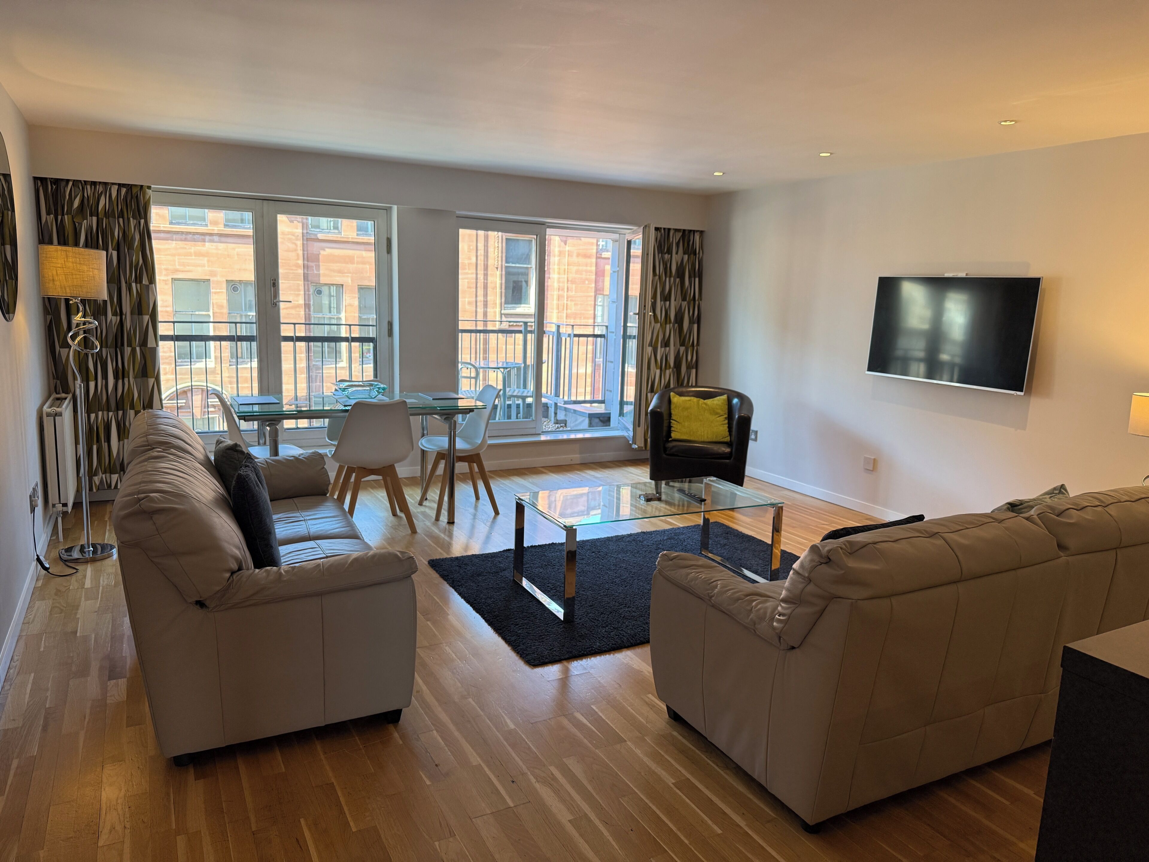 Apartment, 2 Bedrooms, Balcony, City View | Living area | 50-inch Smart TV with digital channels