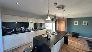 Superior Two King Bedroom Apartment with Sofa Bed | Living area | Flat-screen TV