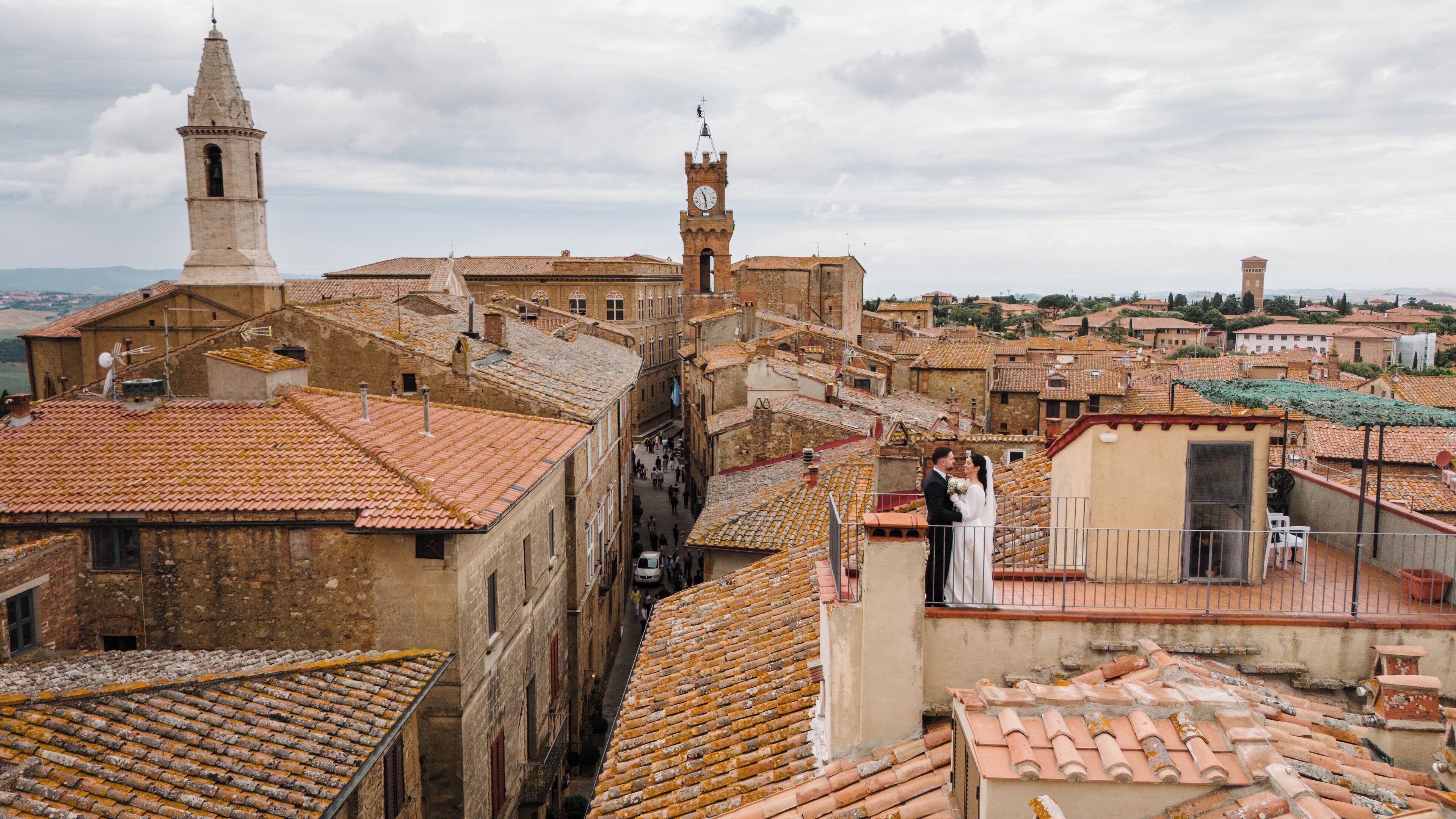 A historic town with narrow streets, traditional buildings, and a prominent clock tower.