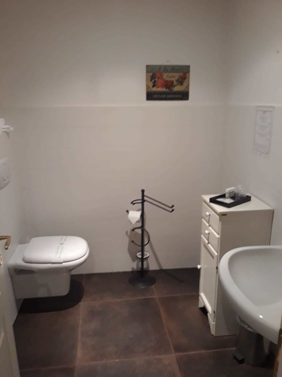 family room | bathroom | shower, rainfall showerhead, designer toiletries, bathrobes