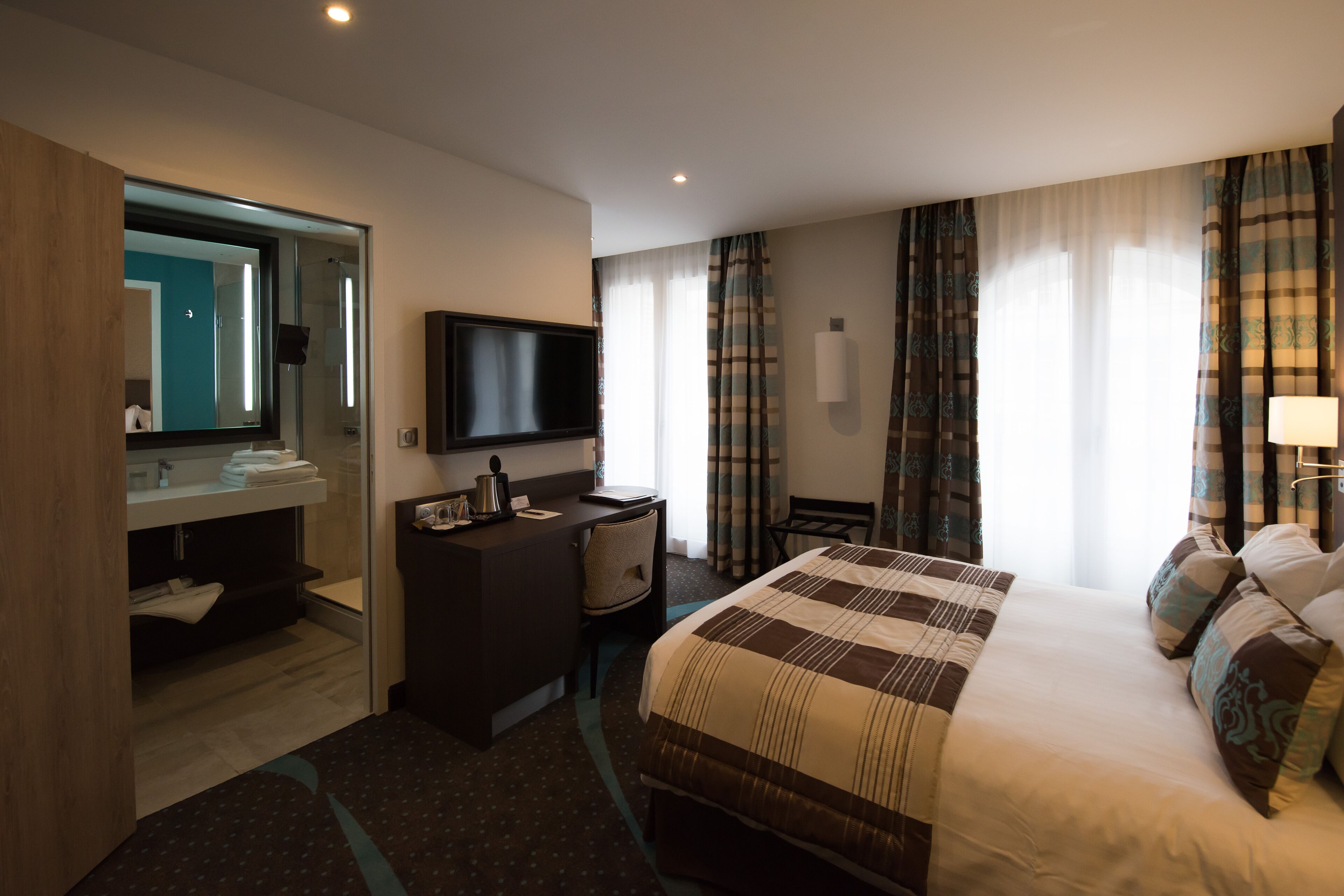Select Comfort beds, minibar, in-room safe, desk