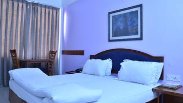 Deluxe Room | Living area | LCD TV, pay films