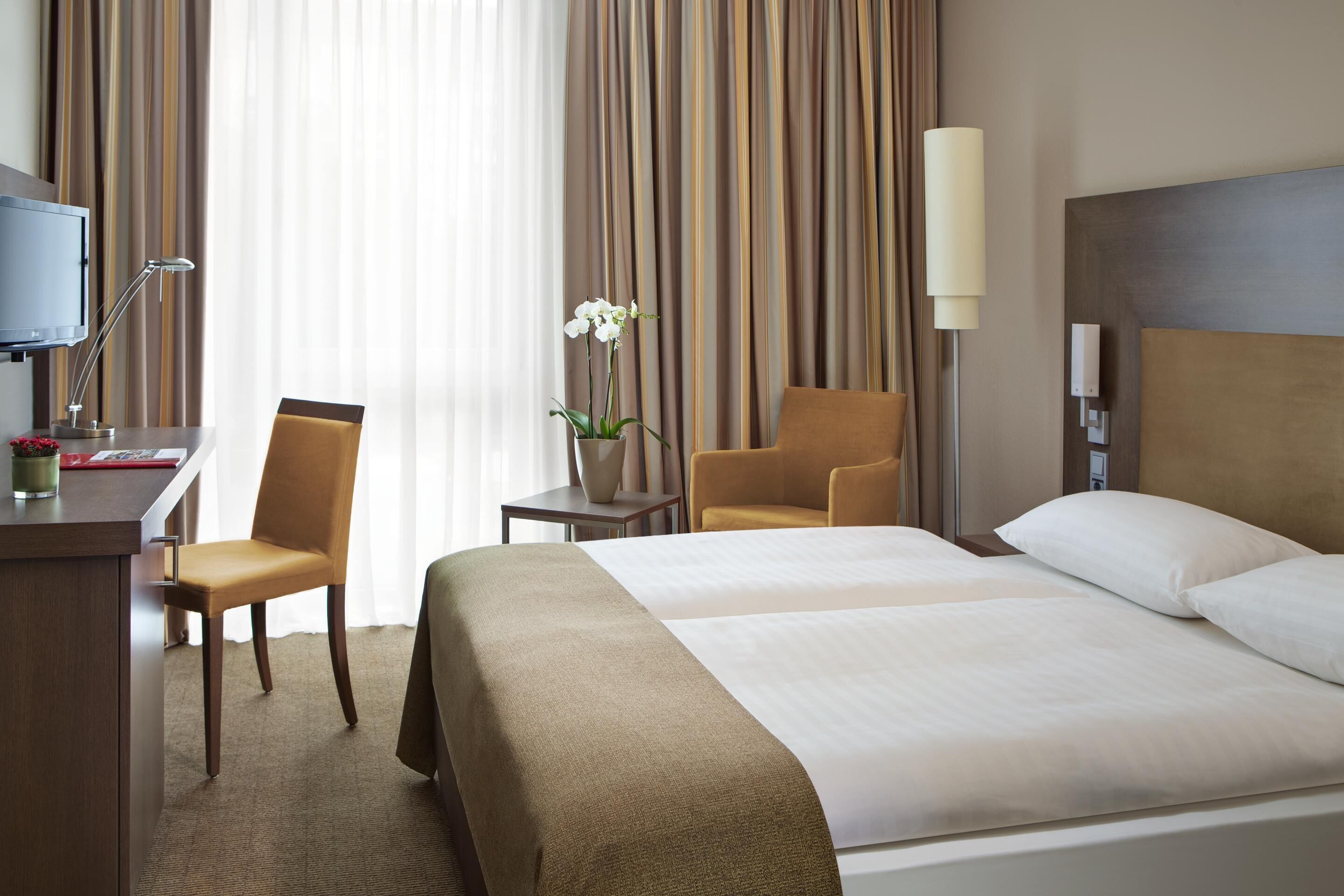 Premium bedding, down comforters, minibar, in-room safe