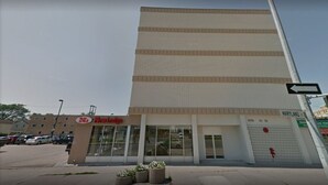 A New Lodge hotel with a modern design, featuring a large glass facade and a prominent sign. - New Lodge (Winnipeg)