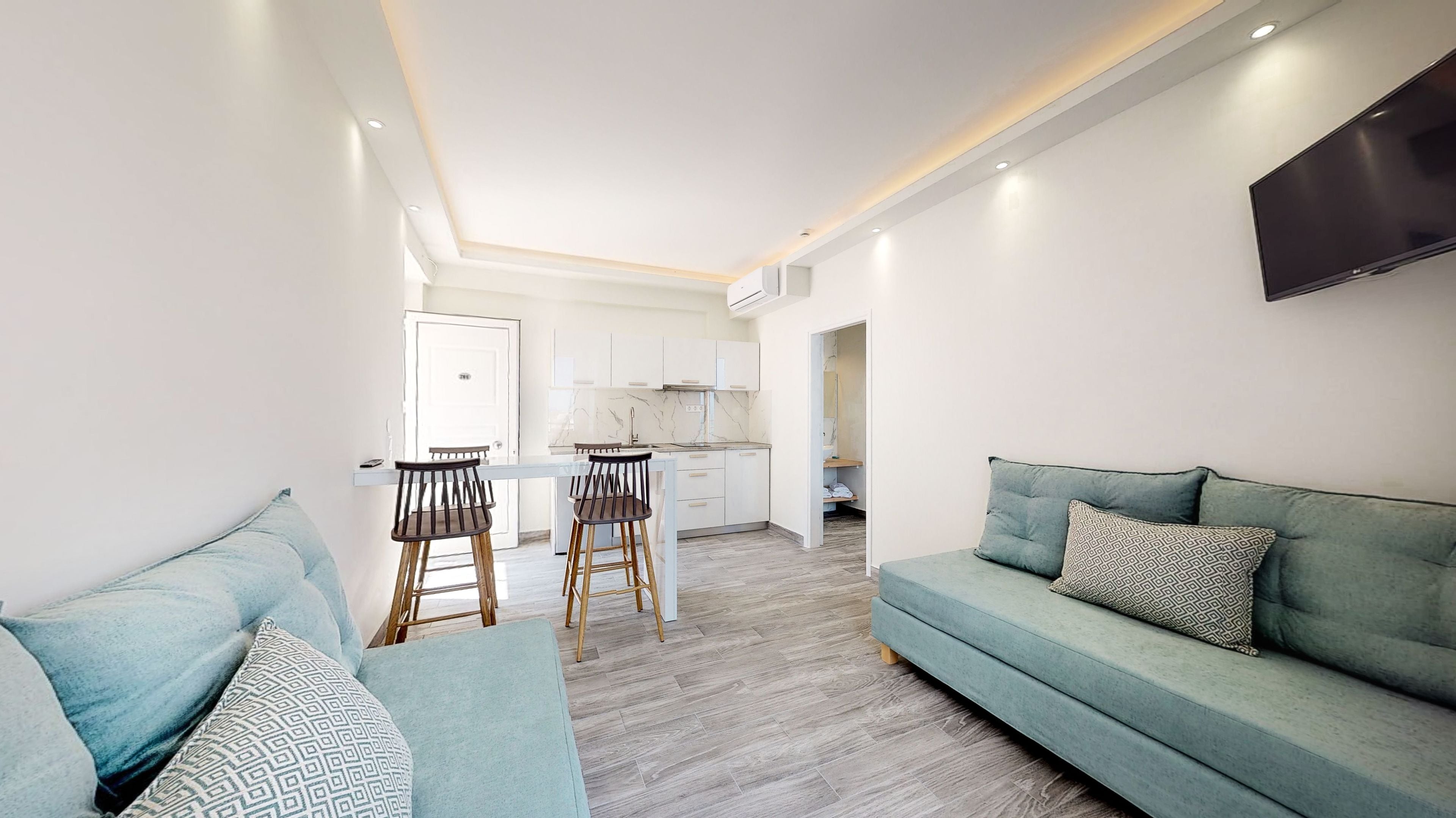 superior apartment, 1 bedroom, sea view | living area | 14-inch flat-screen tv with digital channels, tv