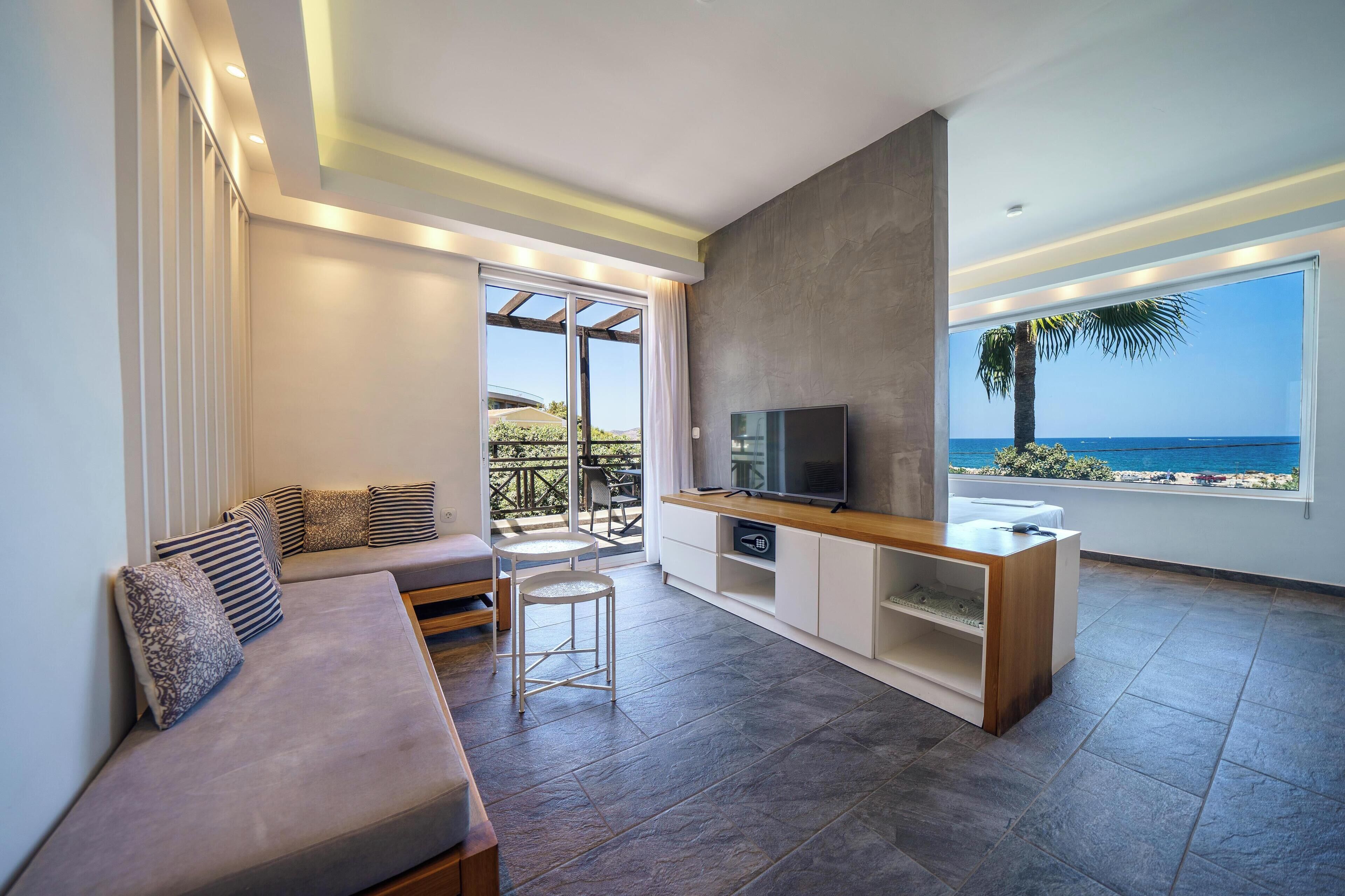 Deluxe Suite, Hot Tub, Sea View | In-room safe, desk, blackout drapes, iron/ironing board