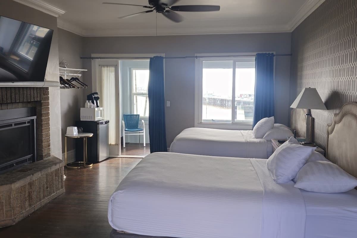 signature room, multiple beds, partial ocean view, ground floor | free wifi, bed sheets