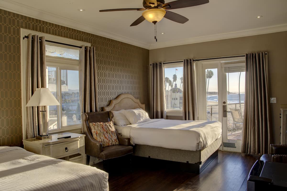 signature room, 2 queen beds, partial ocean view | free wifi, bed sheets