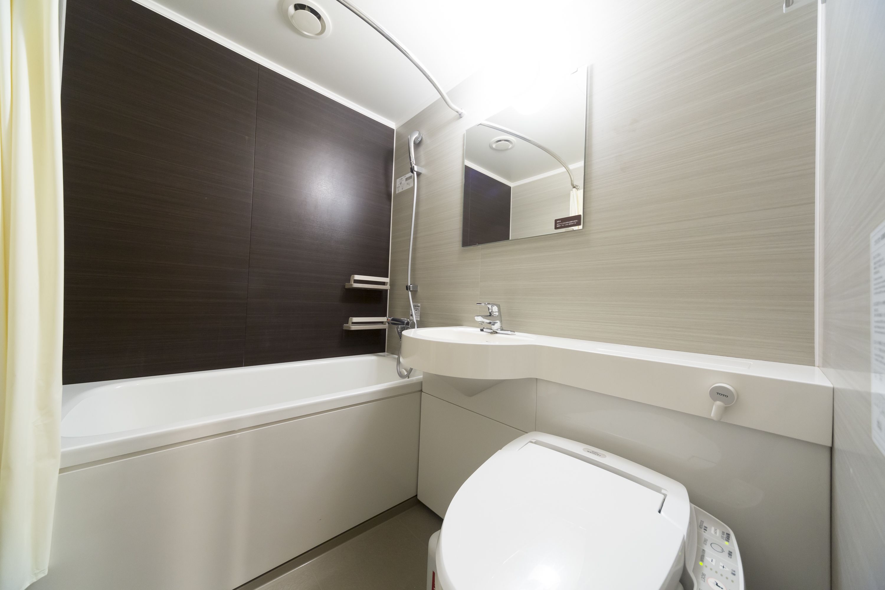 hair dryer, slippers, bidet, towels