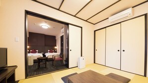 A hotel room with a bed, a desk, a chair, a TV, and a wardrobe. - Dormy Inn Premium Wakayama Natural Hot Spring (Wakayama)
