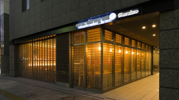 A hotel entrance with a glass facade, a visible reception desk, and a sign above the entrance. - Dormy Inn Premium Wakayama Natural Hot Spring (Wakayama)