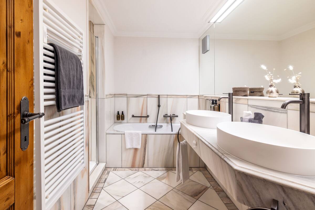 separate bathtub and shower, deep-soaking bathtub, designer toiletries