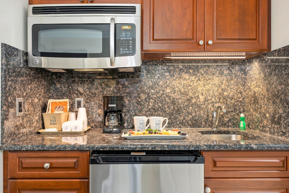 fridge, microwave, coffee/tea maker, cookware/dishes/utensils