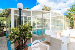 Indoor pool, outdoor pool, pool umbrellas, sun loungers