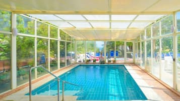 Indoor pool, outdoor pool, pool umbrellas, sun loungers