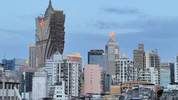 A cityscape with a variety of building styles, including modern high-rises and older, lower-rise structures.