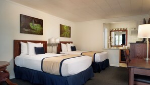 A hotel room with two beds, a desk, a chair, and a mirror. - Travelers Rest Motel (Gordonville)