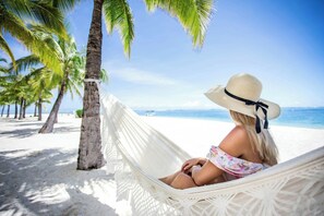 On the beach, white sand, sun-loungers, beach umbrellas - The St. Regis Le Morne Resort, Mauritius (Le Morne)