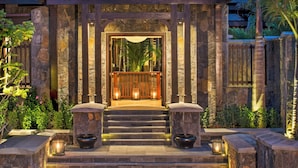 A stone building with a wooden entrance, steps leading up to it, and a view of the sky. - The St. Regis Le Morne Resort, Mauritius (Le Morne)