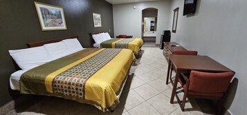 Premium bedding, desk, laptop workspace, blackout drapes