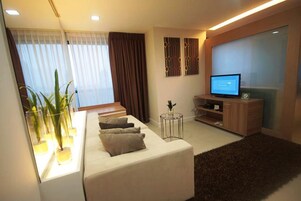 One Bedroom | Living area | 32-inch LED TV with cable channels, TV
