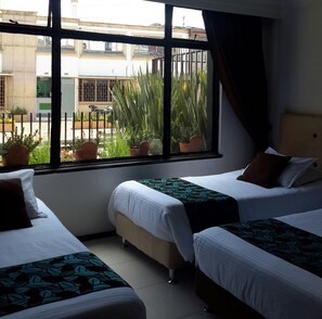 Triple Room | Individually decorated, desk, blackout drapes, free WiFi - Central House Hotel (Bogotá)
