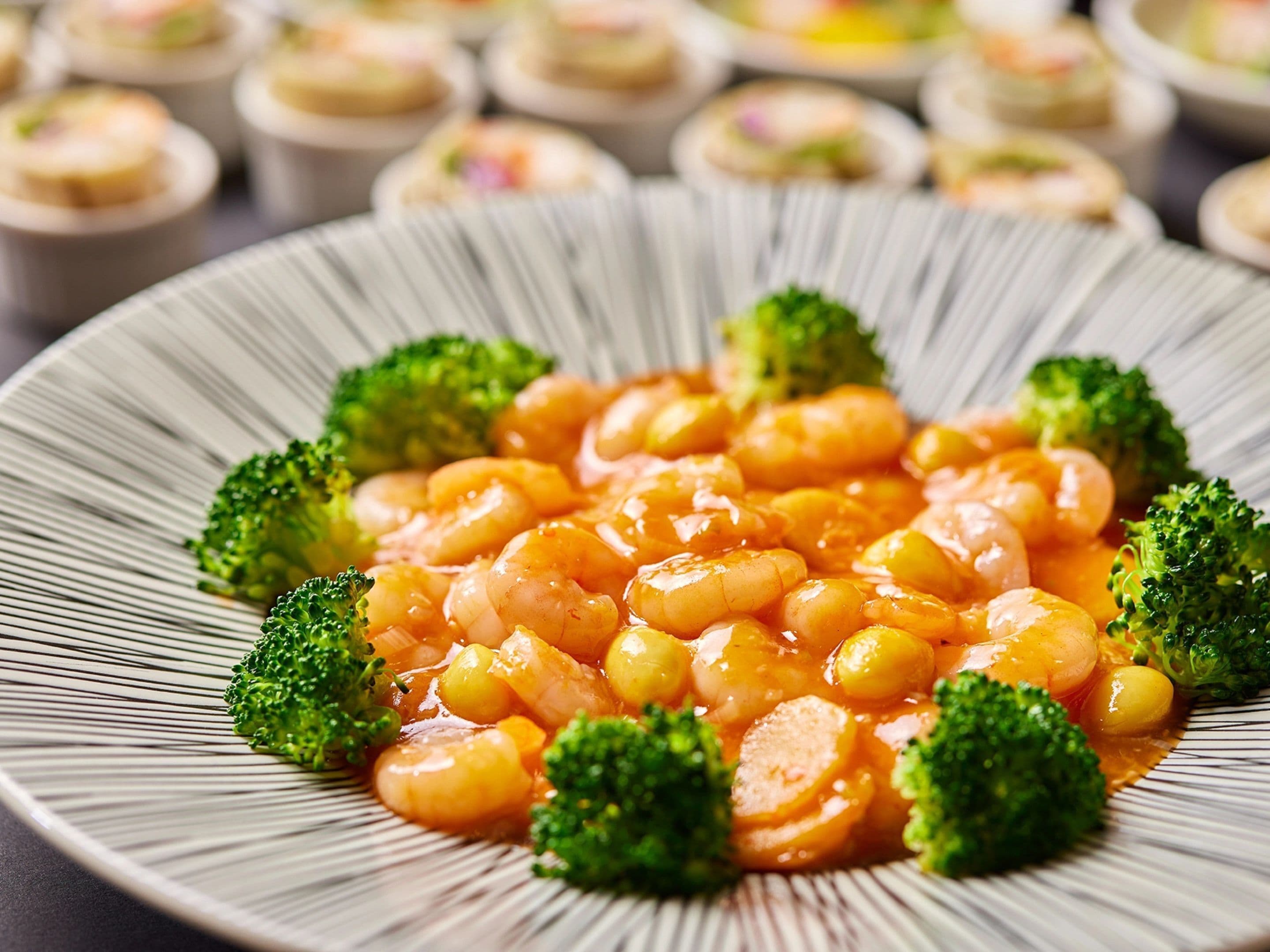 A plate of shrimp and broccoli.