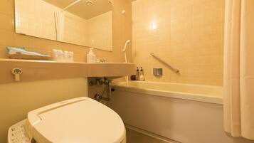 A bathroom with a toilet, sink, and bathtub.