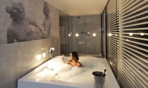 Eco-friendly toiletries, hair dryer, slippers, bidet