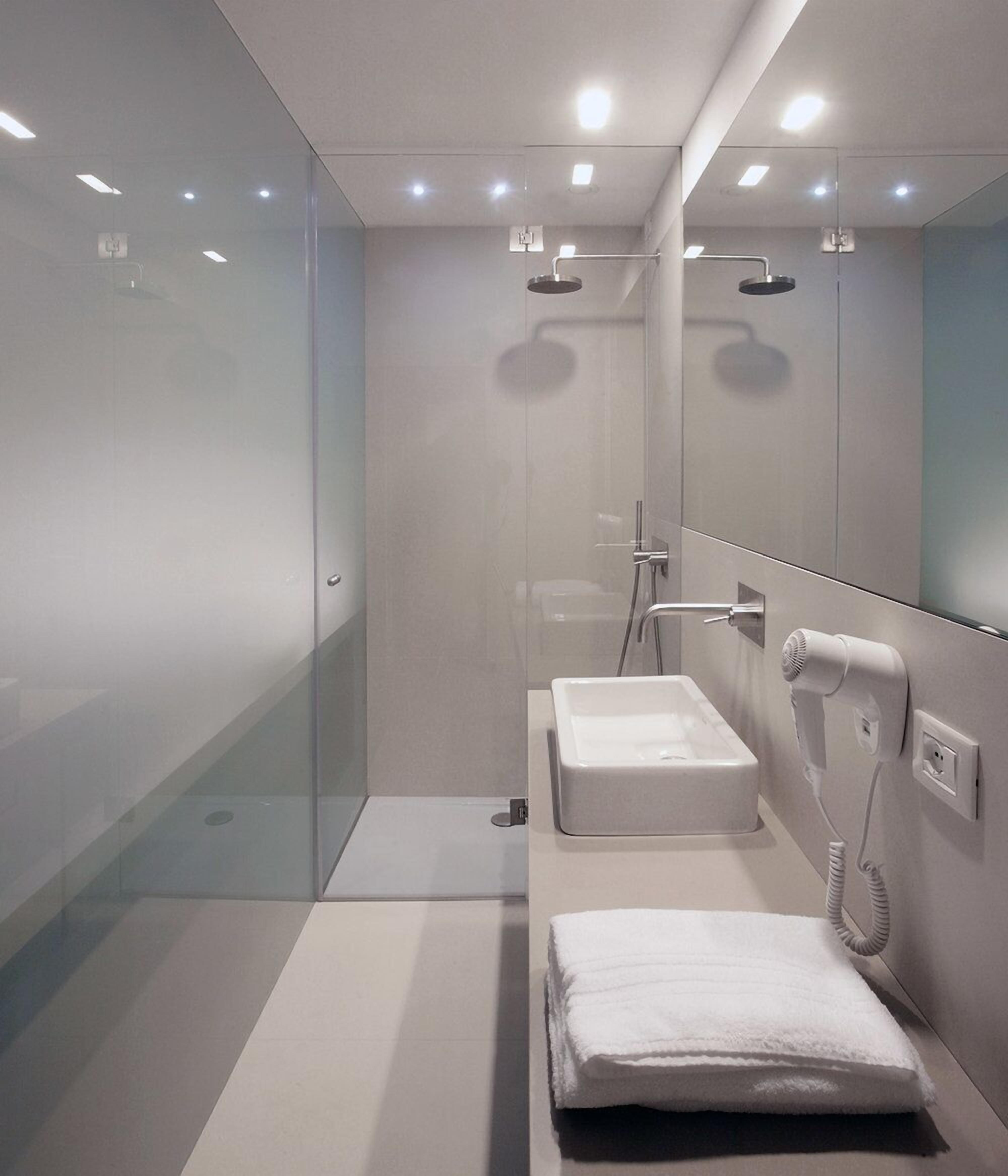 hair dryer, slippers, bidet, towels