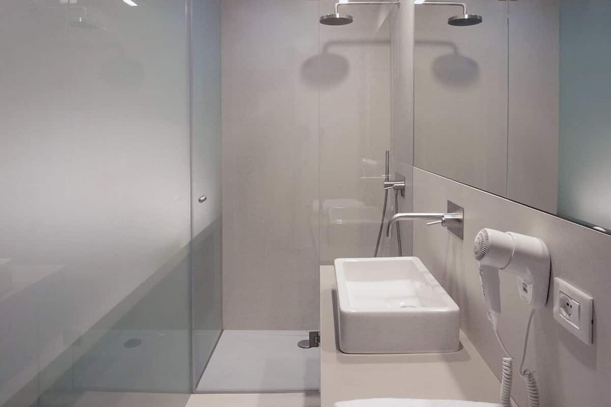 hair dryer, slippers, bidet, towels