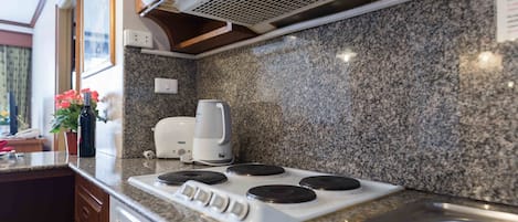 Suite, 2 Bedrooms | Private kitchen | Fridge, microwave, stovetop, electric kettle