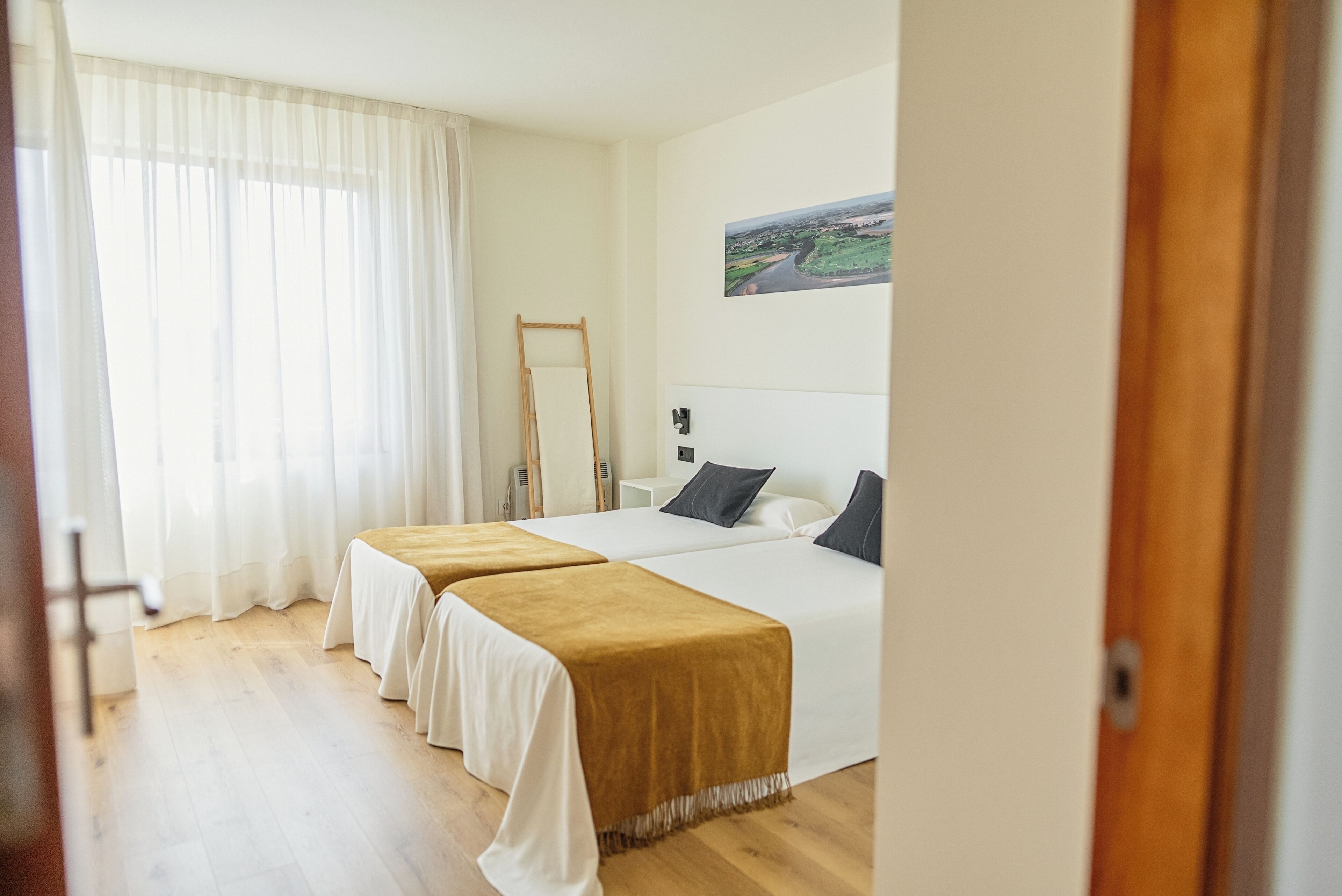 Pillow-top beds, laptop workspace, blackout curtains, cots/infant beds