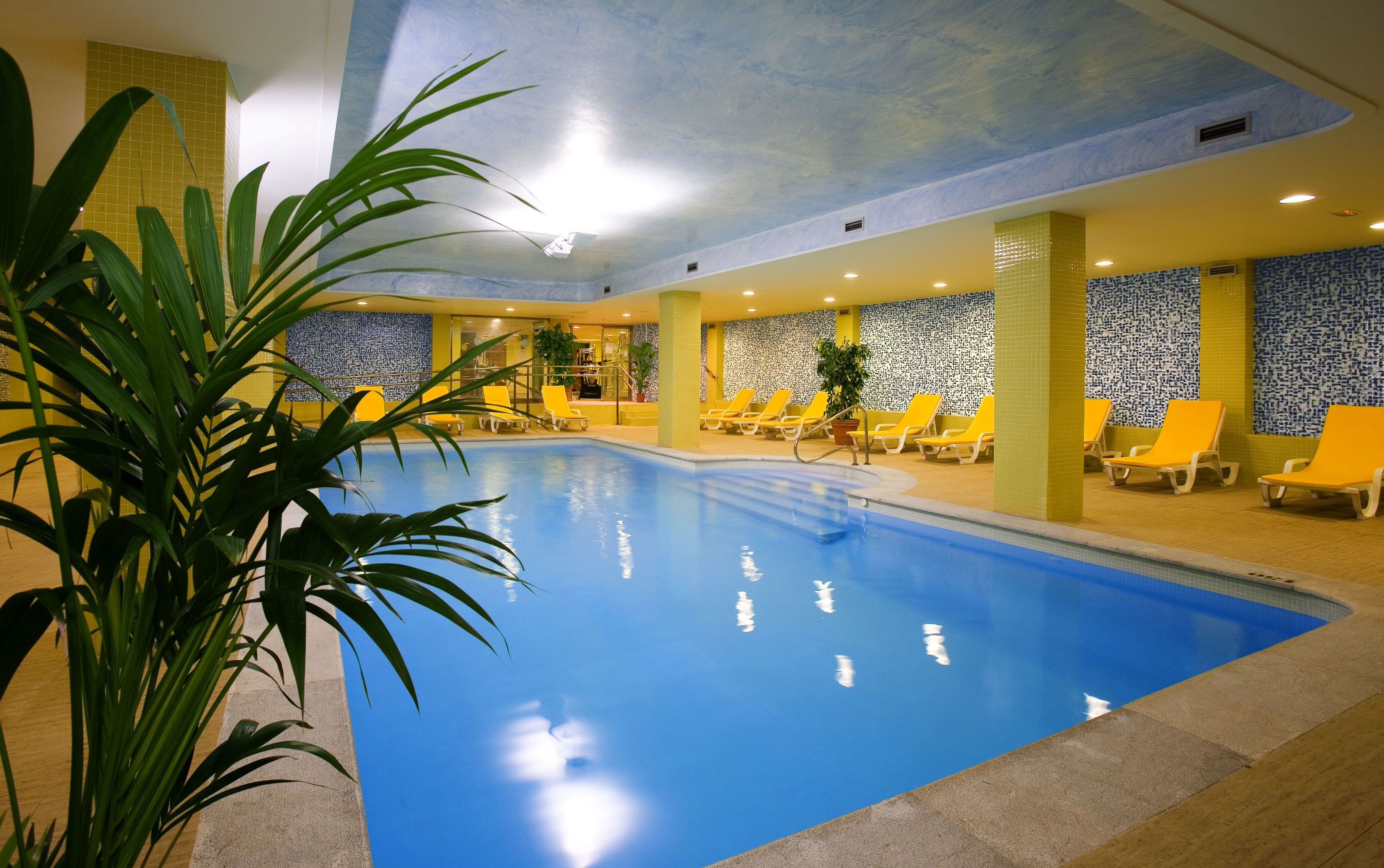 Indoor pool, seasonal outdoor pool, pool umbrellas, pool loungers