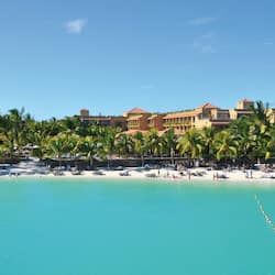 On the beach, white sand, sun-loungers, beach towels