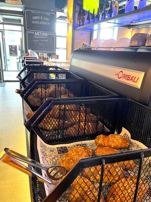 Freshly baked bread and pastries are available in this food service area.