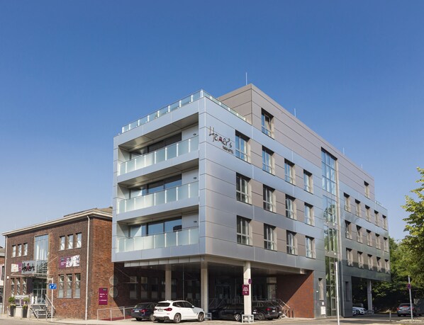 Heritage's Park Hotel features a striking glass facade and a mix of glass and brick construction.