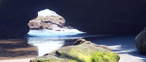 Beach nearby, black sand, beach umbrellas