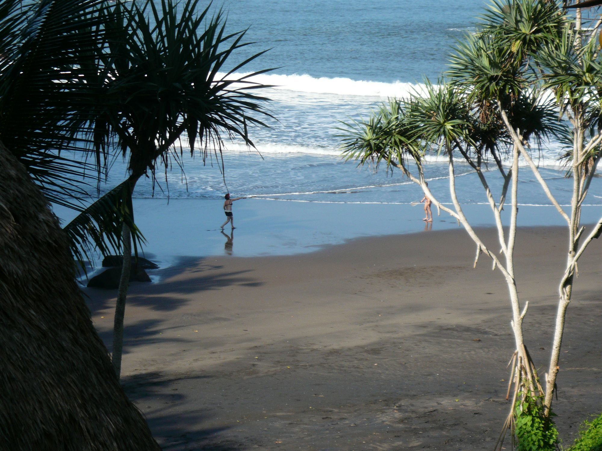 beach nearby, black sand, beach umbrellas