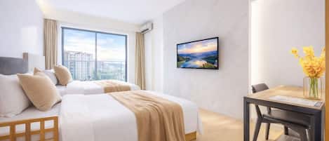 A hotel room with two beds, a desk, a chair, a TV, and a window with a city view.