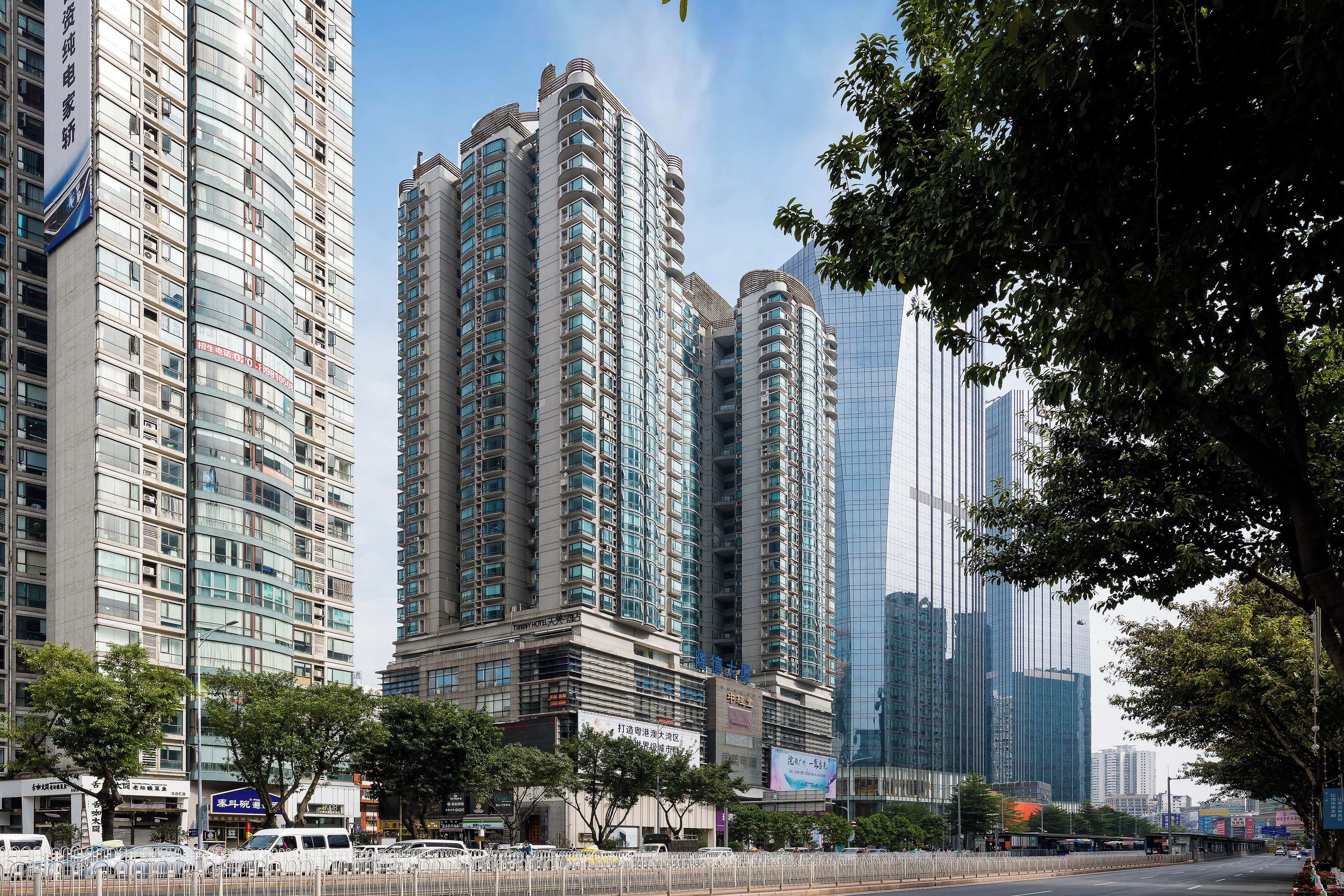 A high-rise building with multiple floors, large windows, and a modern architectural design.