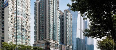 A high-rise building with multiple floors, large windows, and a modern architectural design.
