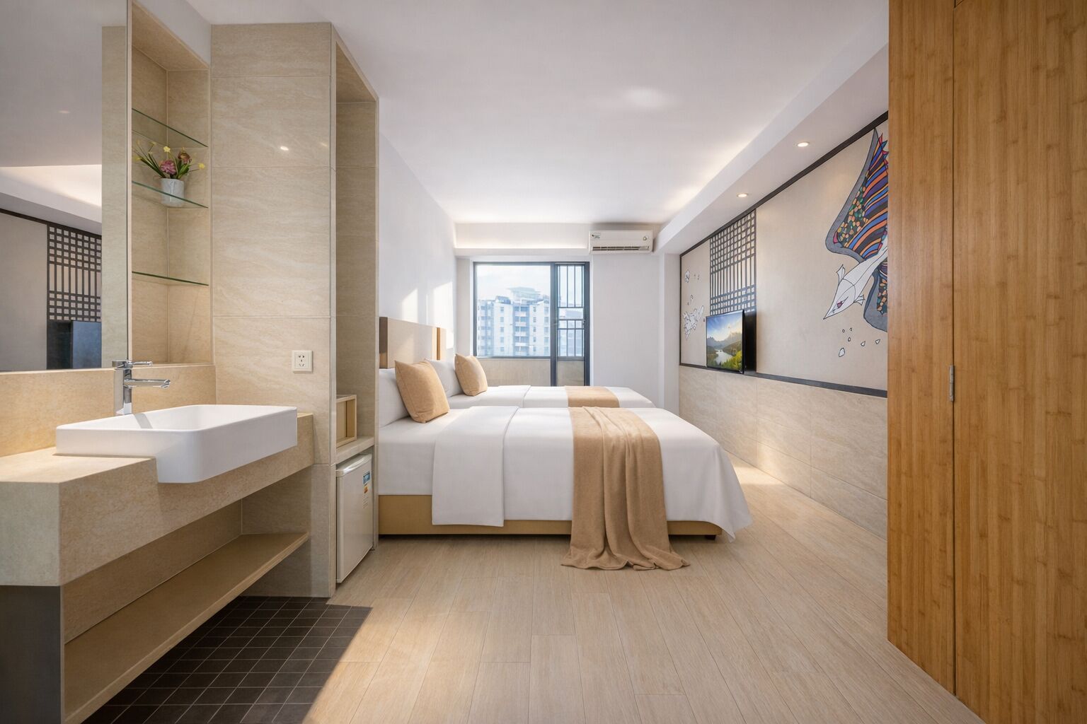 A modern hotel room with a large bed, a built-in sink, a mirror, and a city view.