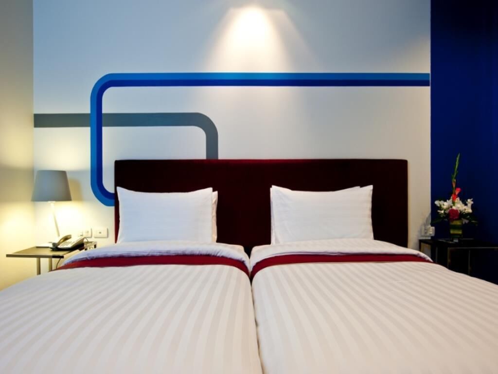 Luxe beddengoed, een minibar, een kluis op de kamer, een bureau