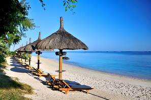 On the beach, sun-loungers, beach umbrellas, beach towels - Le Cardinal Exclusive Resort (Trou aux Biches)